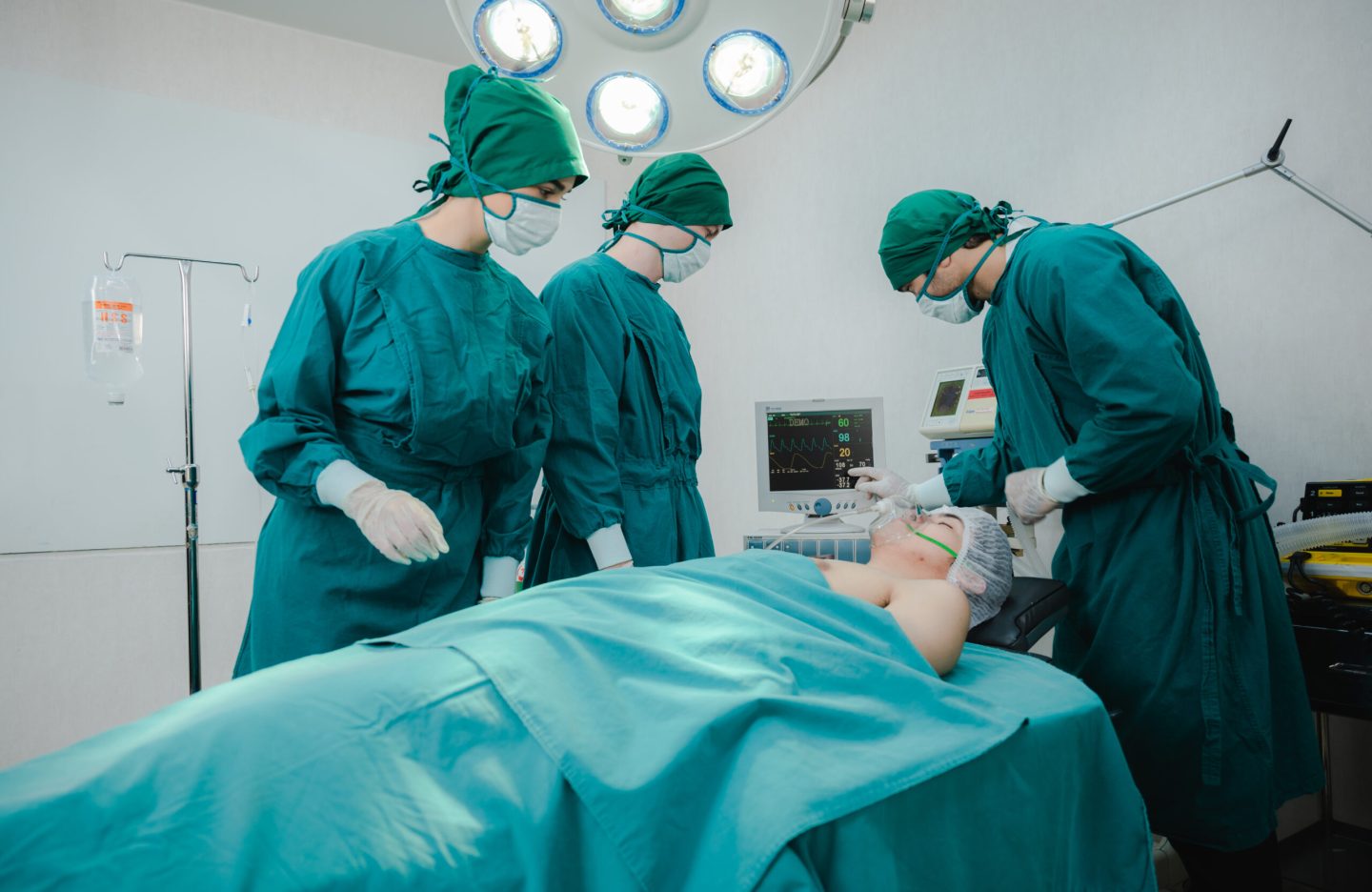 professional surgeon doctor teamwork person working in hospital operation room with surgery medical health equipment with surgical patient and nurse, emergency medicine treatment clinic concept